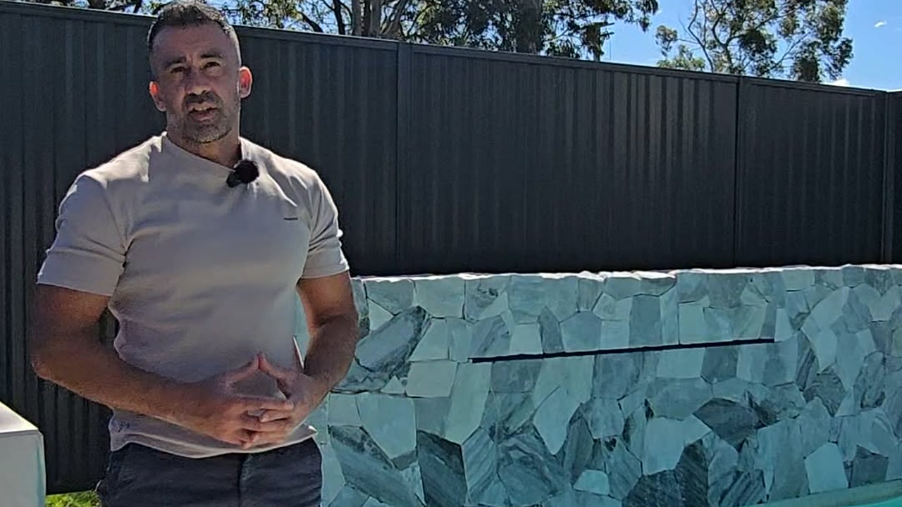 Alan Dean discussing property investing beside a residential pool